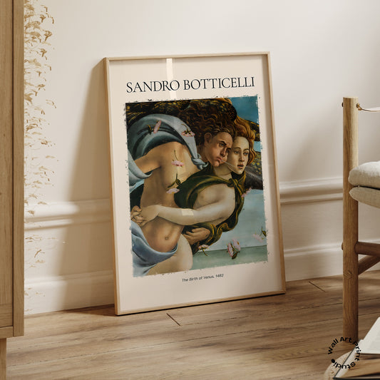 Framed artwork of Sandro Botticelli's 'The Birth of Venus' on a wooden floor.
